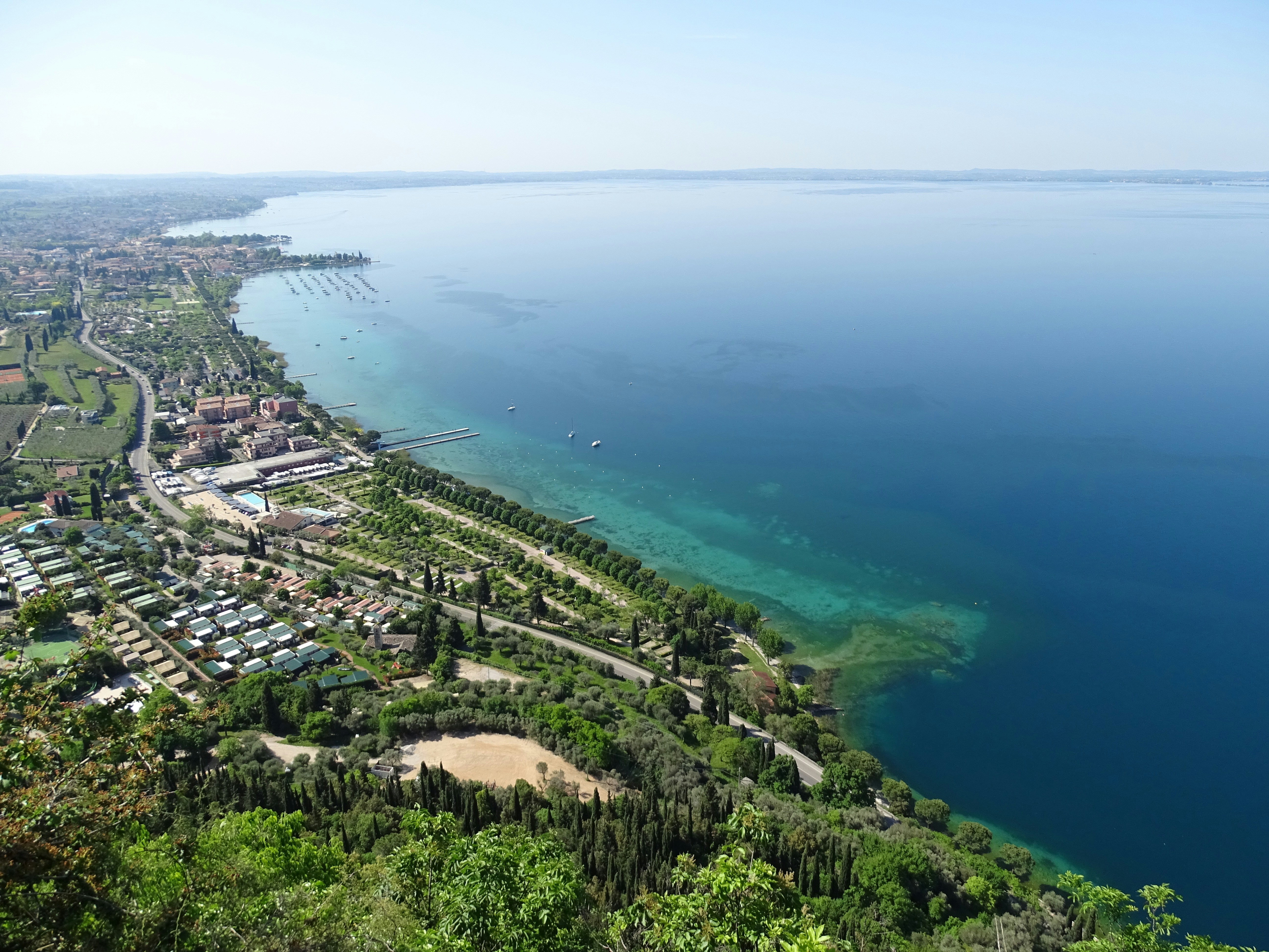 aerial view of city buildings near body of water during daytime
