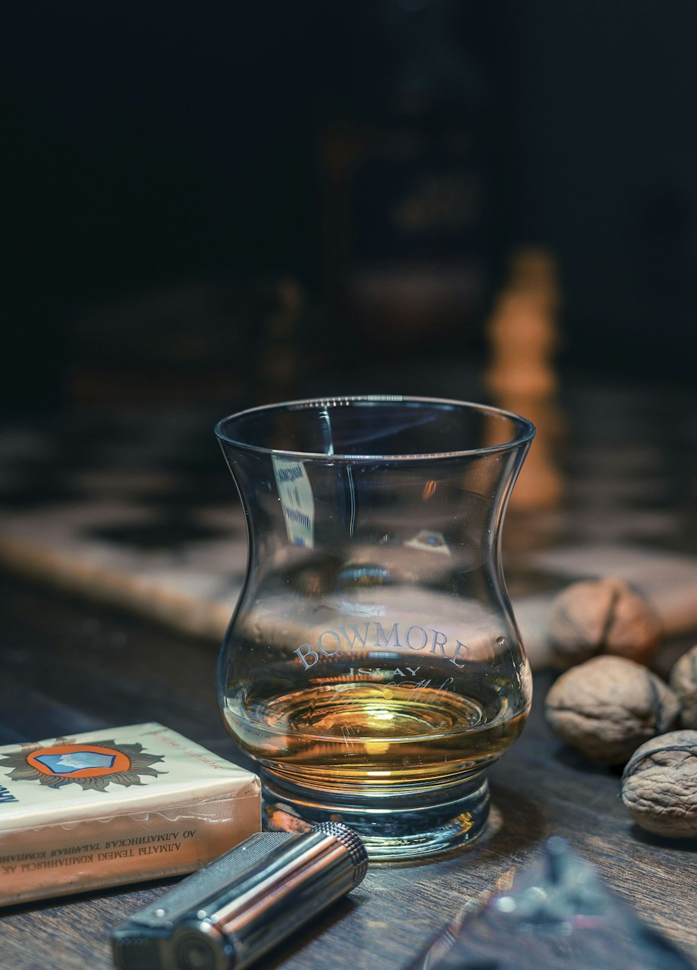 clear shot glass on brown wooden table