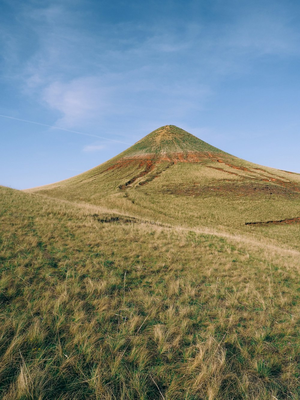 brown mountain under blue sky during daytime