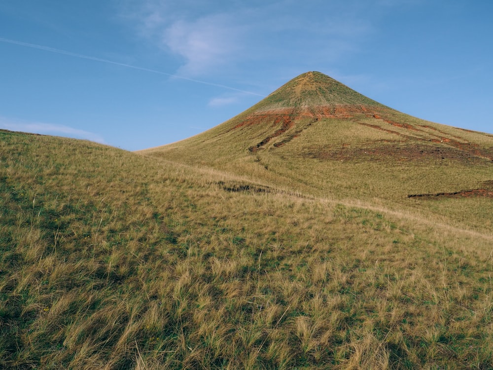 brown mountain under blue sky during daytime