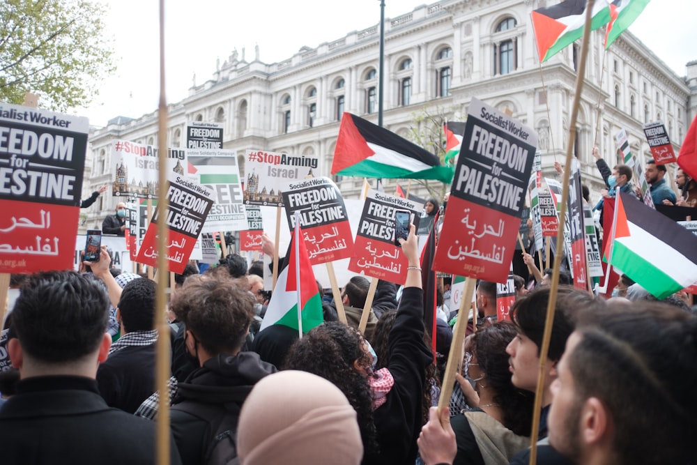 people holding flags during daytime