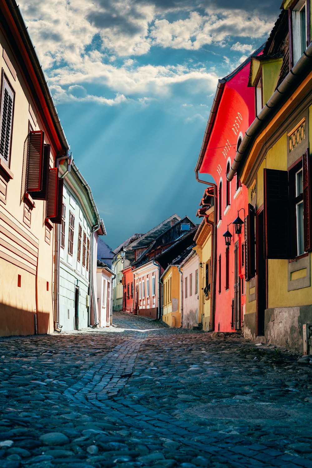 white red and brown concrete houses under blue sky during daytime