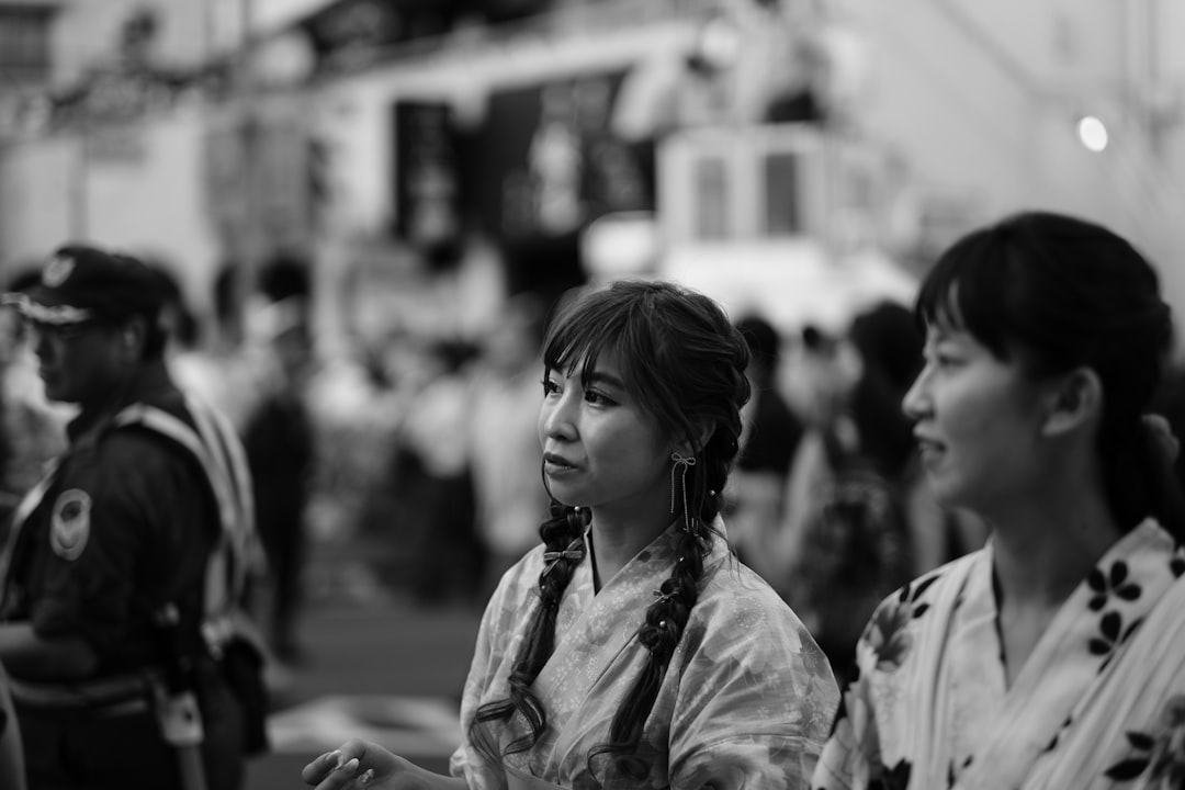 grayscale photo of woman in jacket