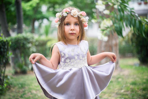 Little girl in a white twirl dress with a flower crown
