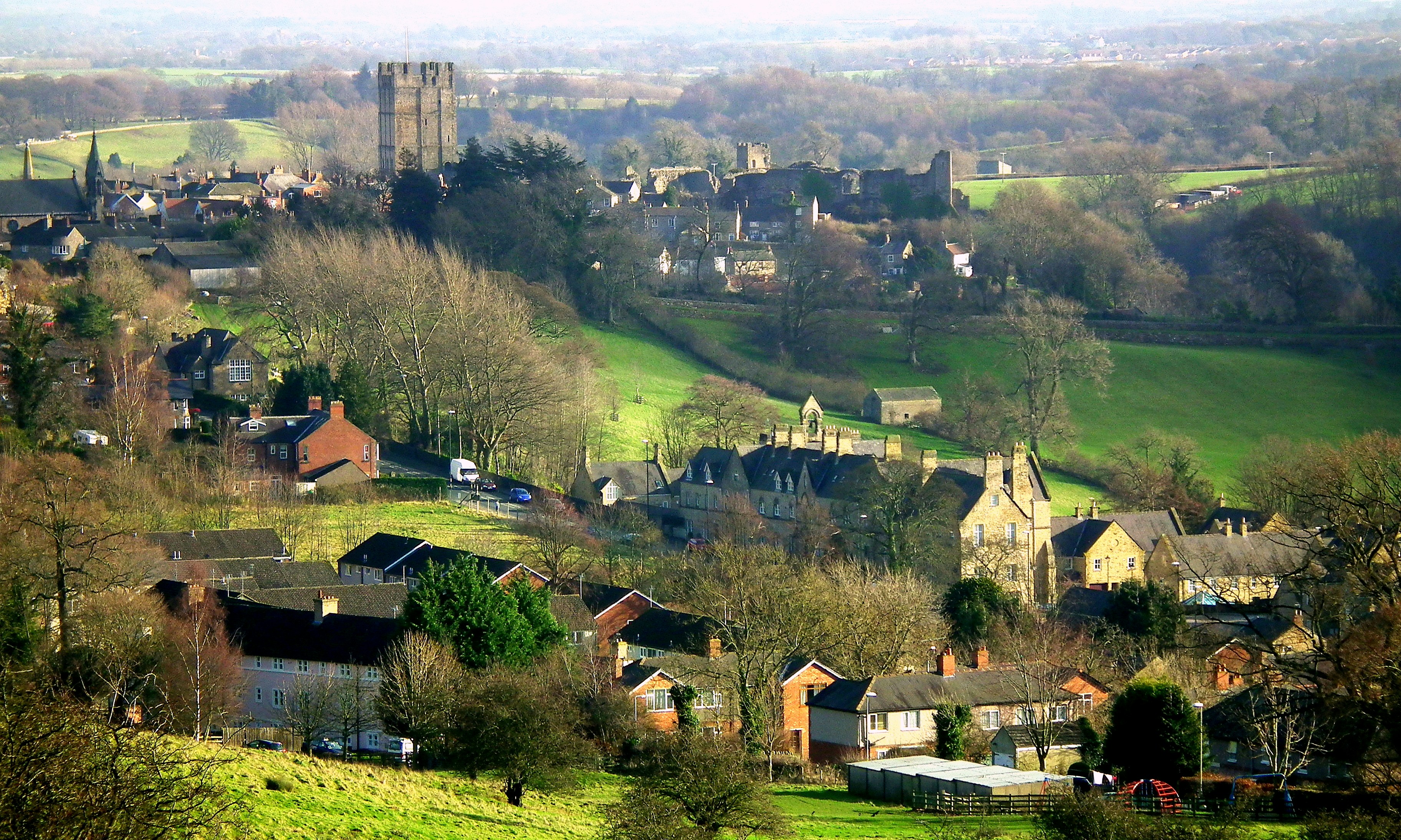 aerial view of green grass field and houses during daytime