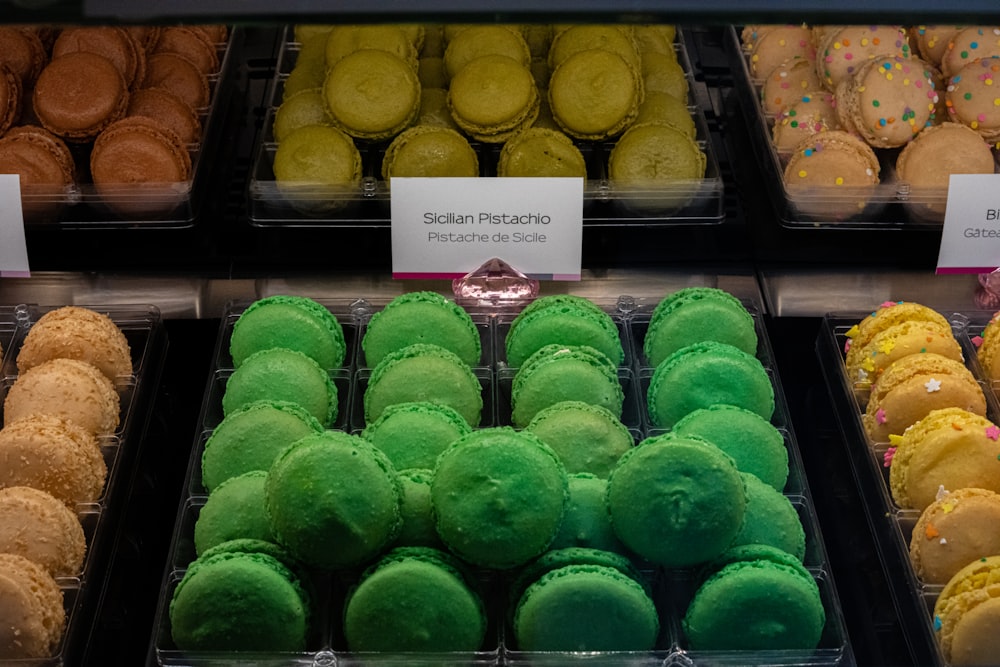 green and brown cupcakes on white metal rack