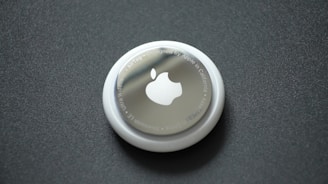 white round plastic lid on black surface