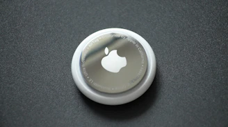 white round plastic lid on black surface
