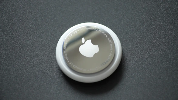 white round plastic lid on black surface