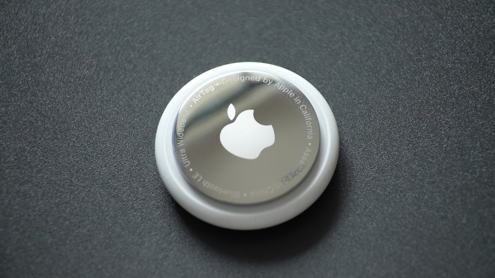 white round plastic lid on black surface