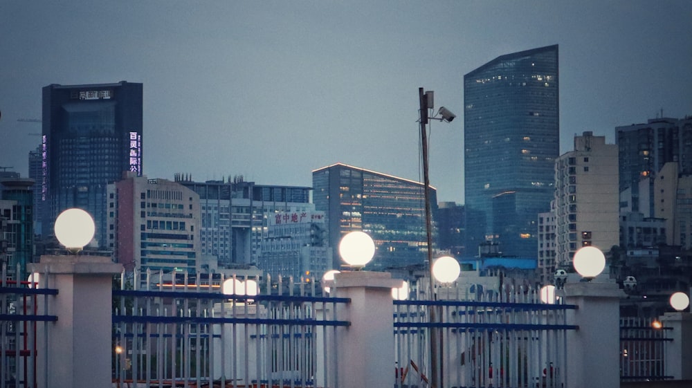 black street light near city buildings during night time