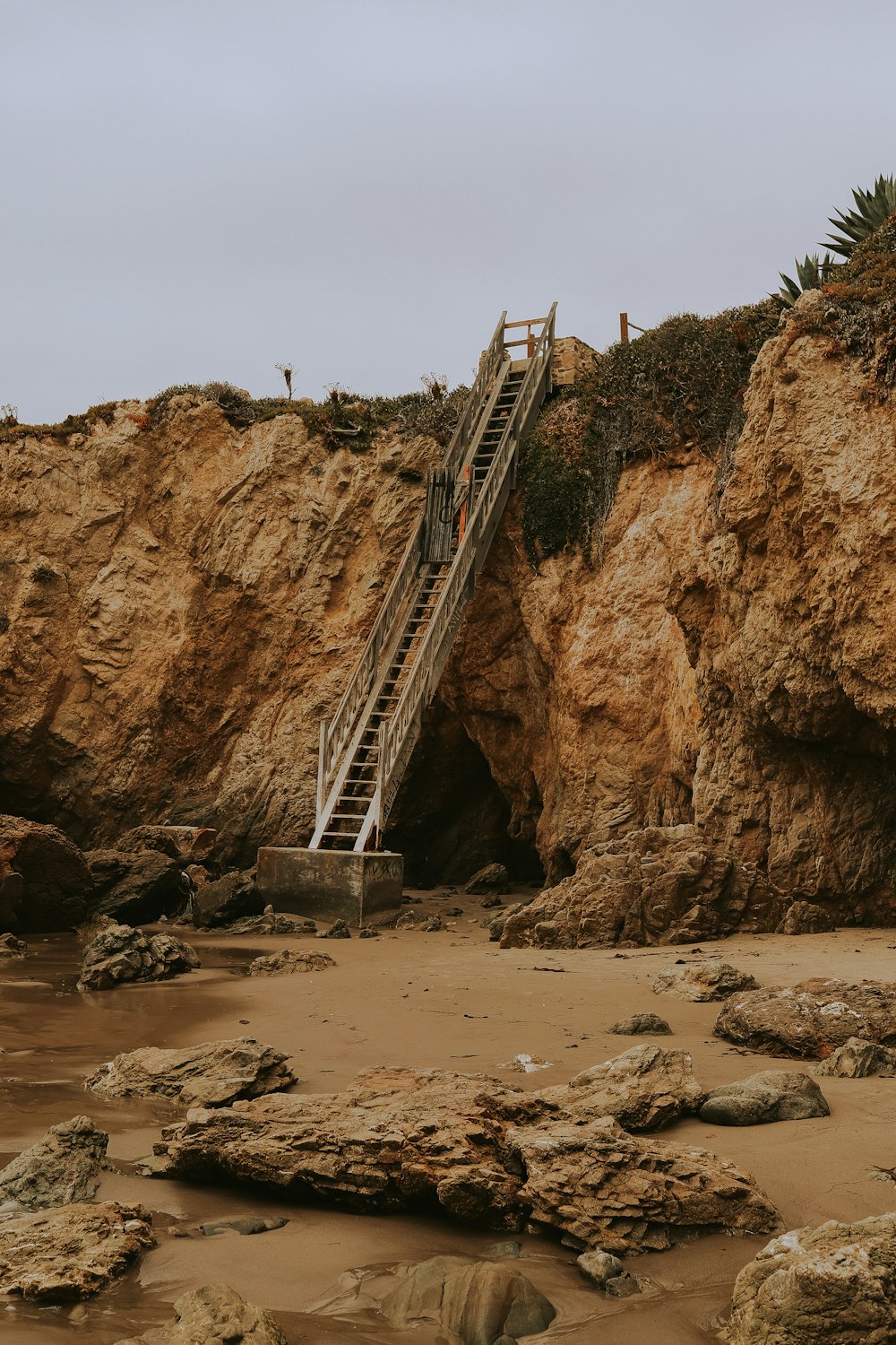 white metal bridge over the sea