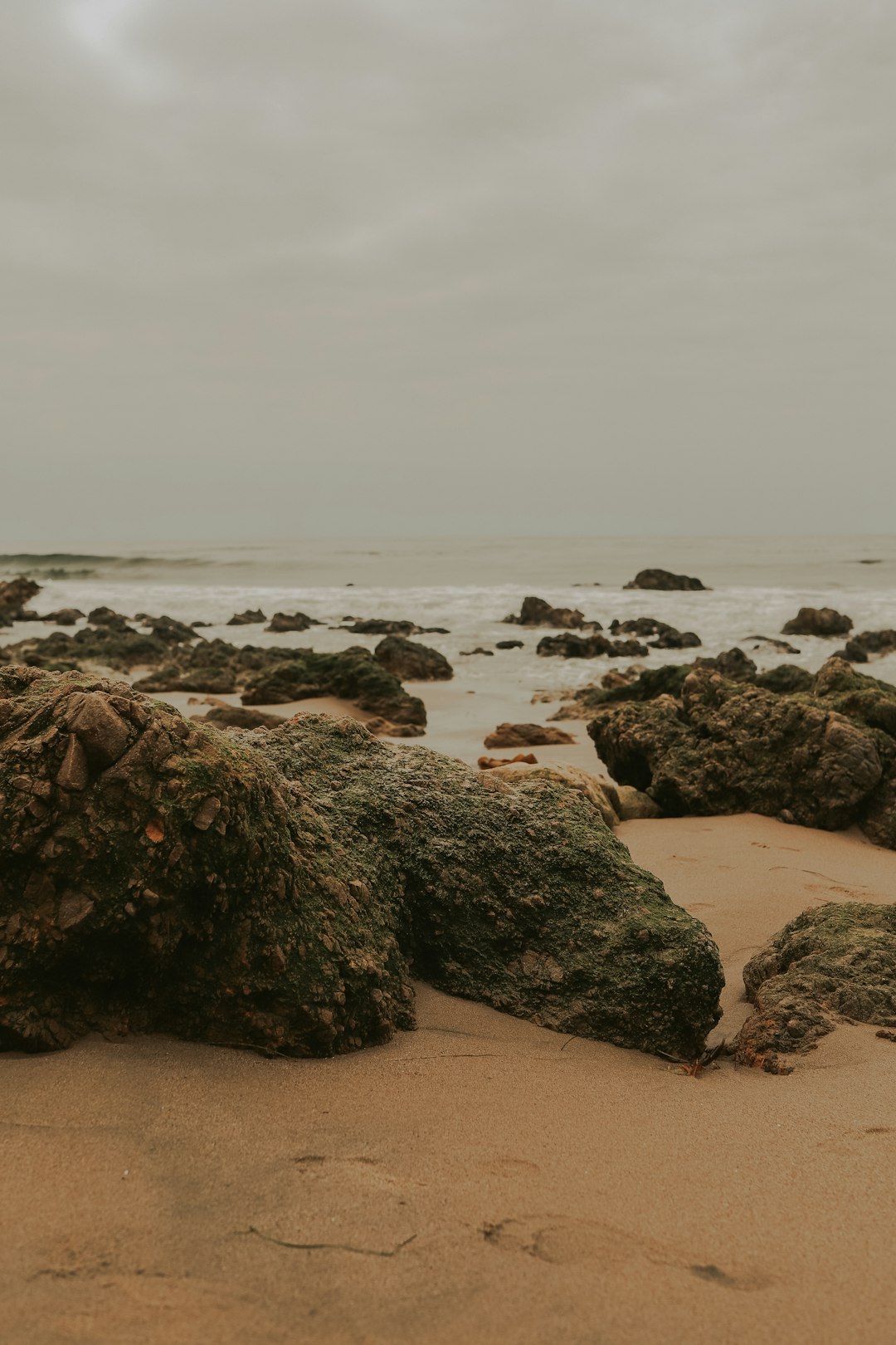 gray rocks on seashore during daytime