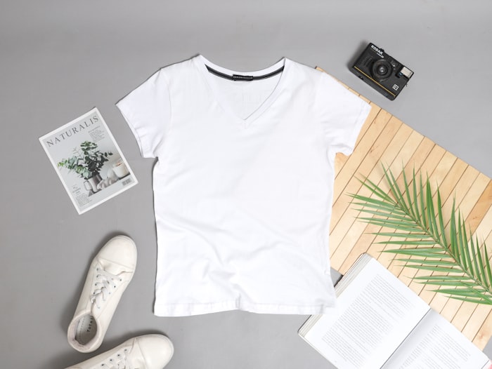 Cream cotton t-shirt laid flat