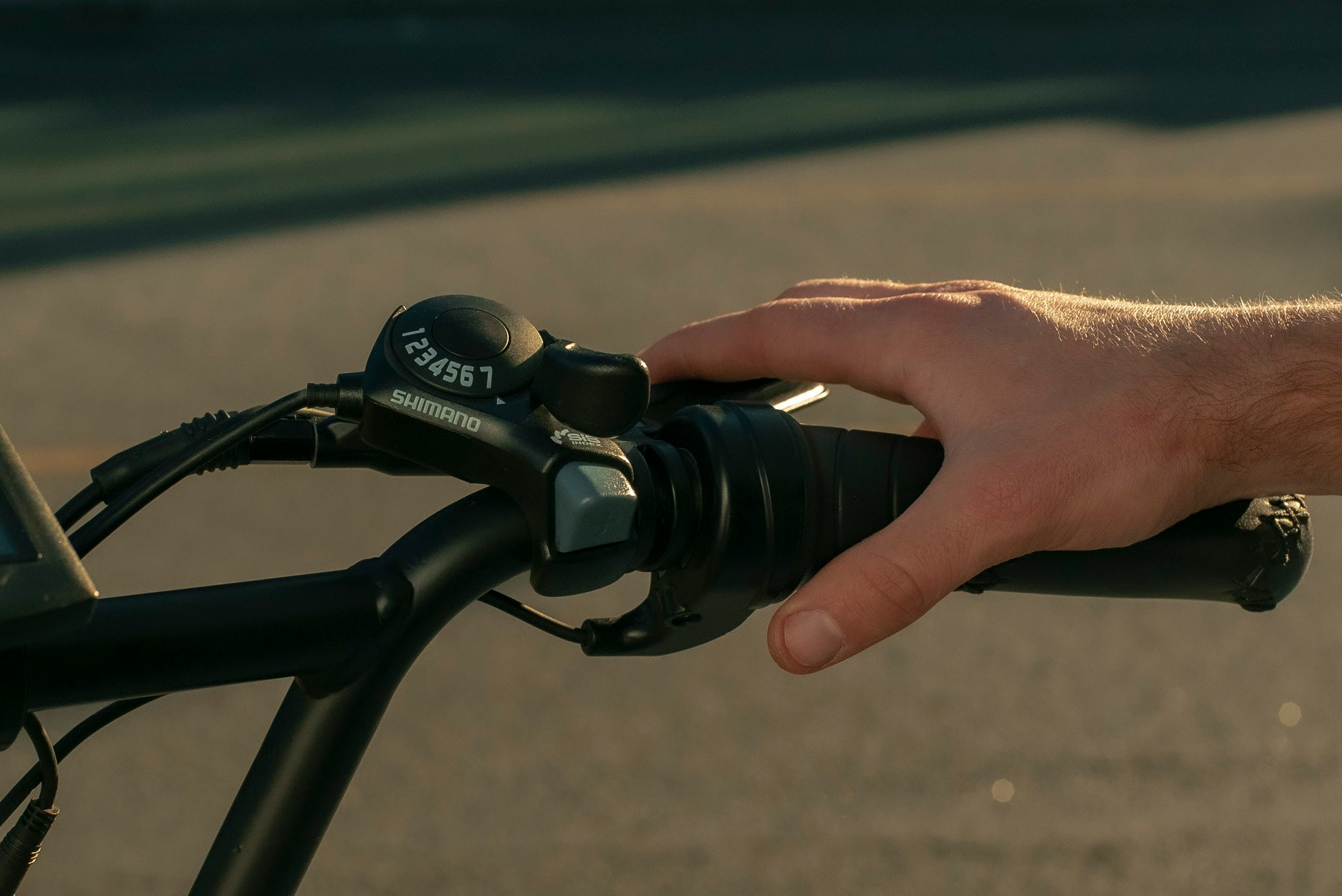 person holding black bicycle handle bar