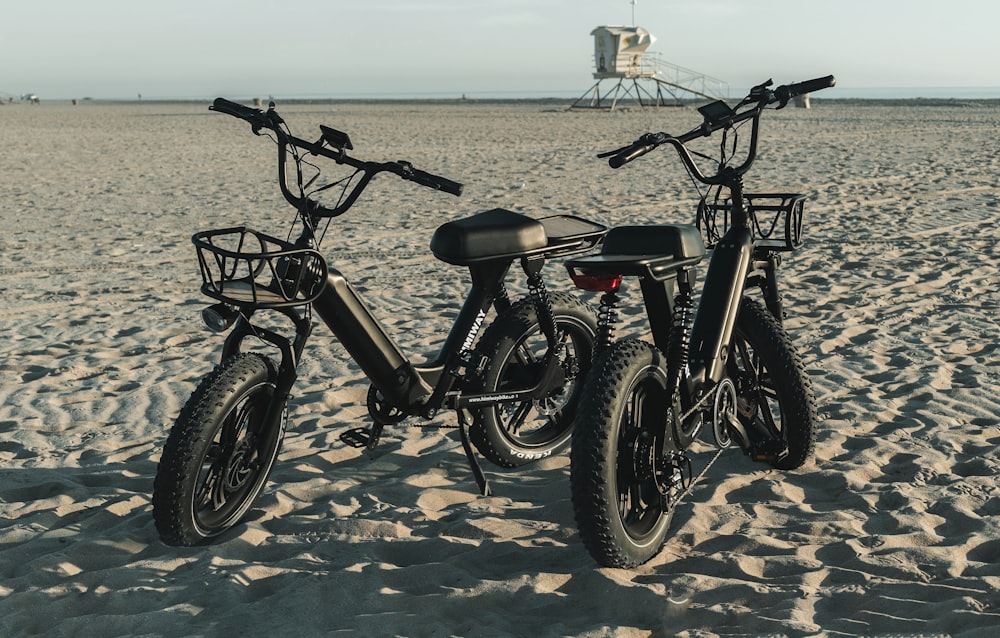 black and gray mountain bike on brown sand during daytime