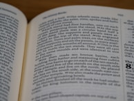 An open book with text on both visible pages. The focus is on the right page where the text is clear, showing paragraphs and numbered sections.