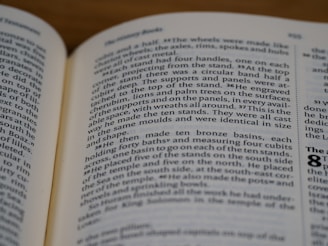 An open book with text on both visible pages. The focus is on the right page where the text is clear, showing paragraphs and numbered sections.