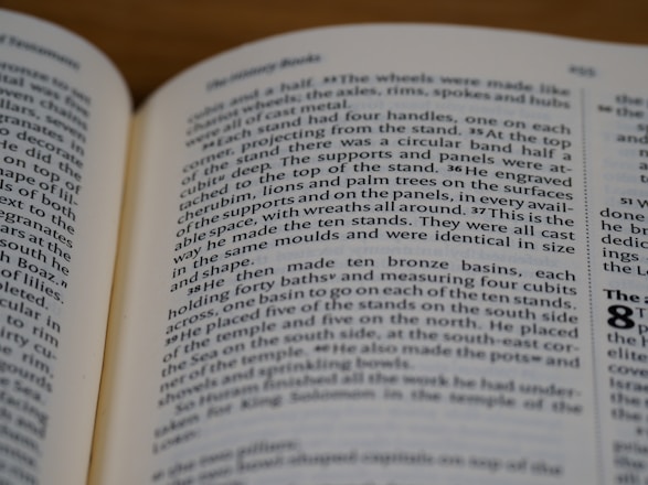 An open book with text on both visible pages. The focus is on the right page where the text is clear, showing paragraphs and numbered sections.