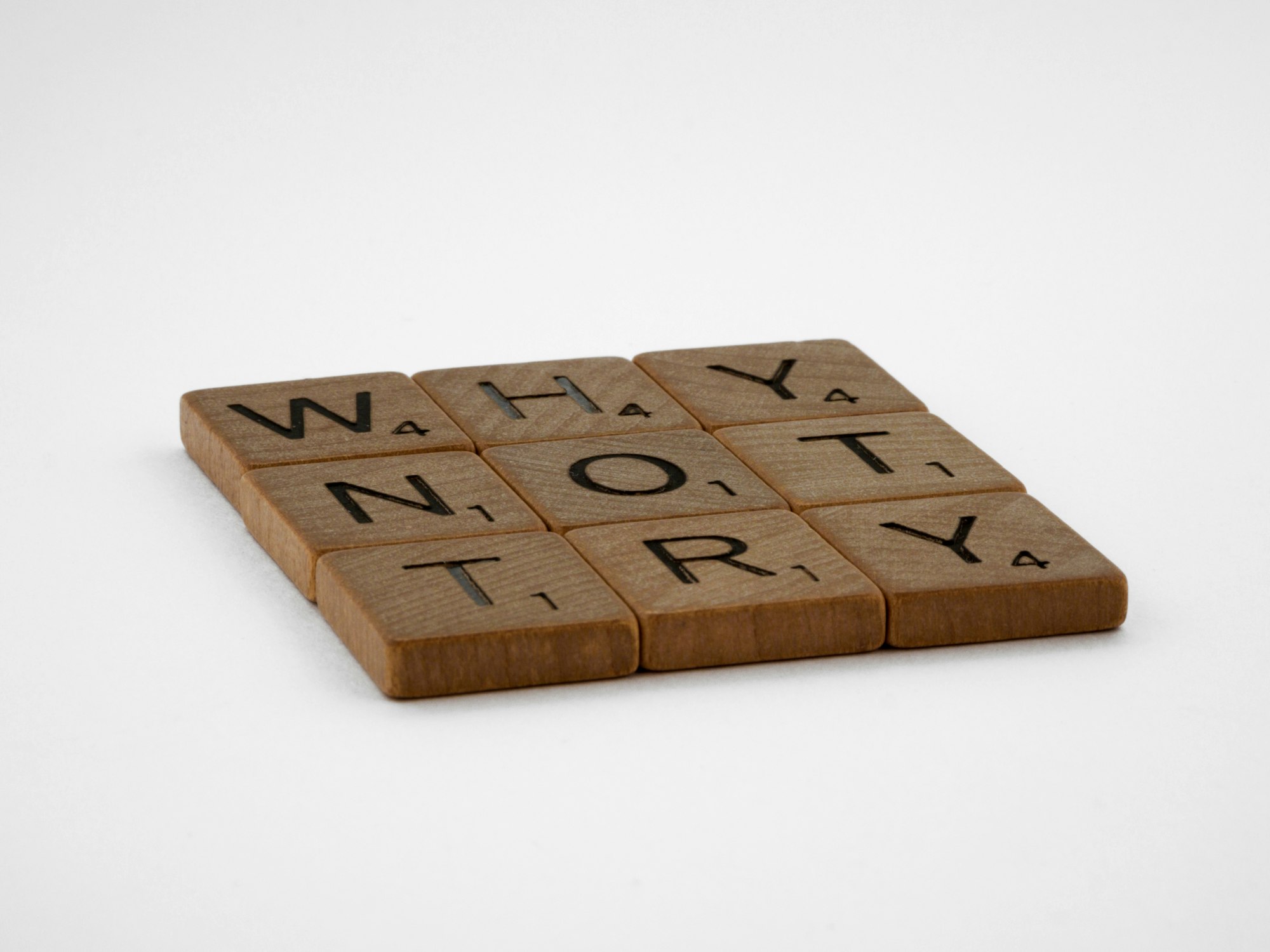 scrabble, scrabble pieces, lettering, letters, wood, scrabble tiles, white background, words, quote, letters, type, typography, design, layout, focus, bokeh, blur, photography, images, image, try, go for it, just do it, don't give up, keep going, one foot in front of the other, if not now when, procrastination, determination, motivation, 