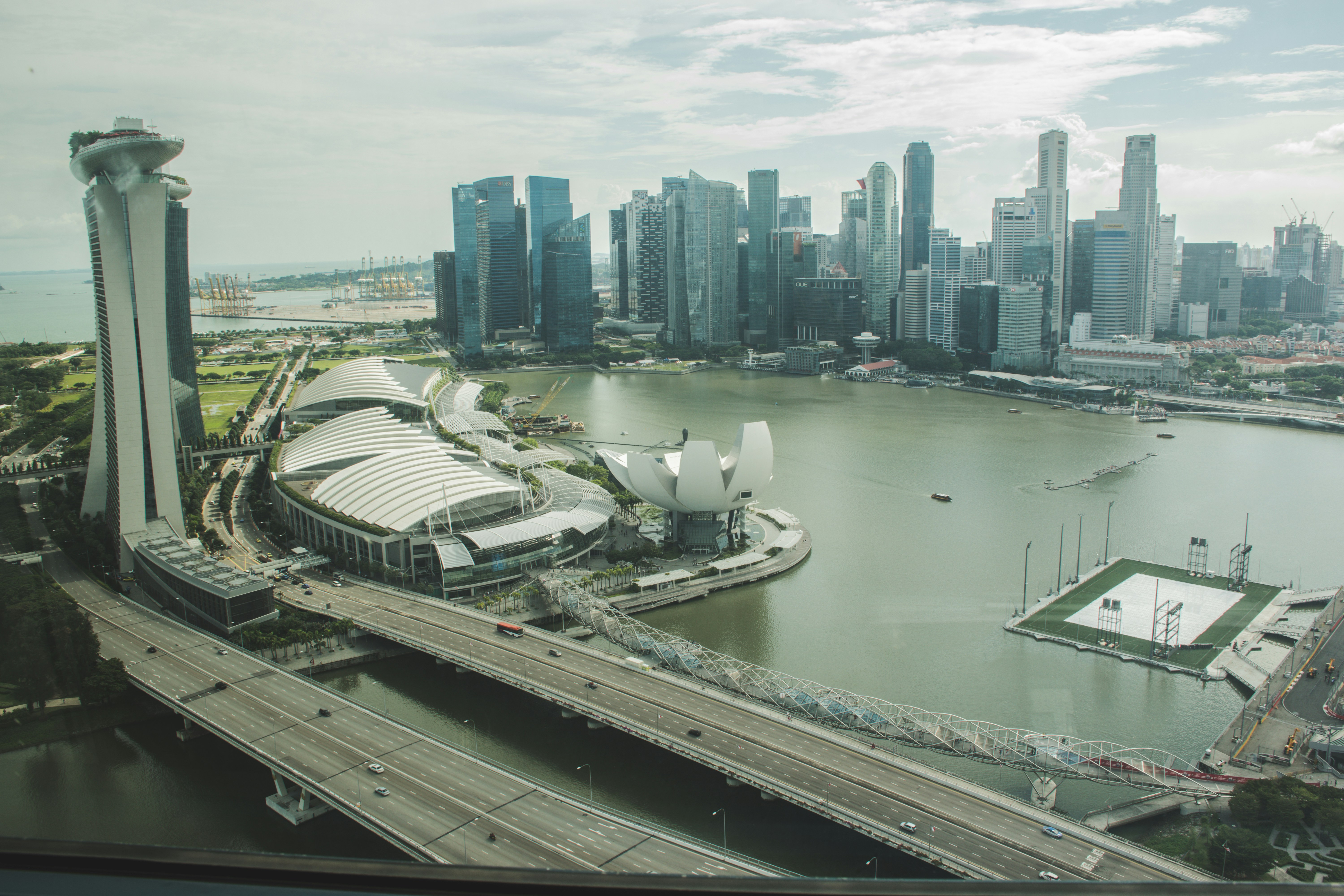 white and black boat on body of water near city buildings during daytime, Singapore skyline