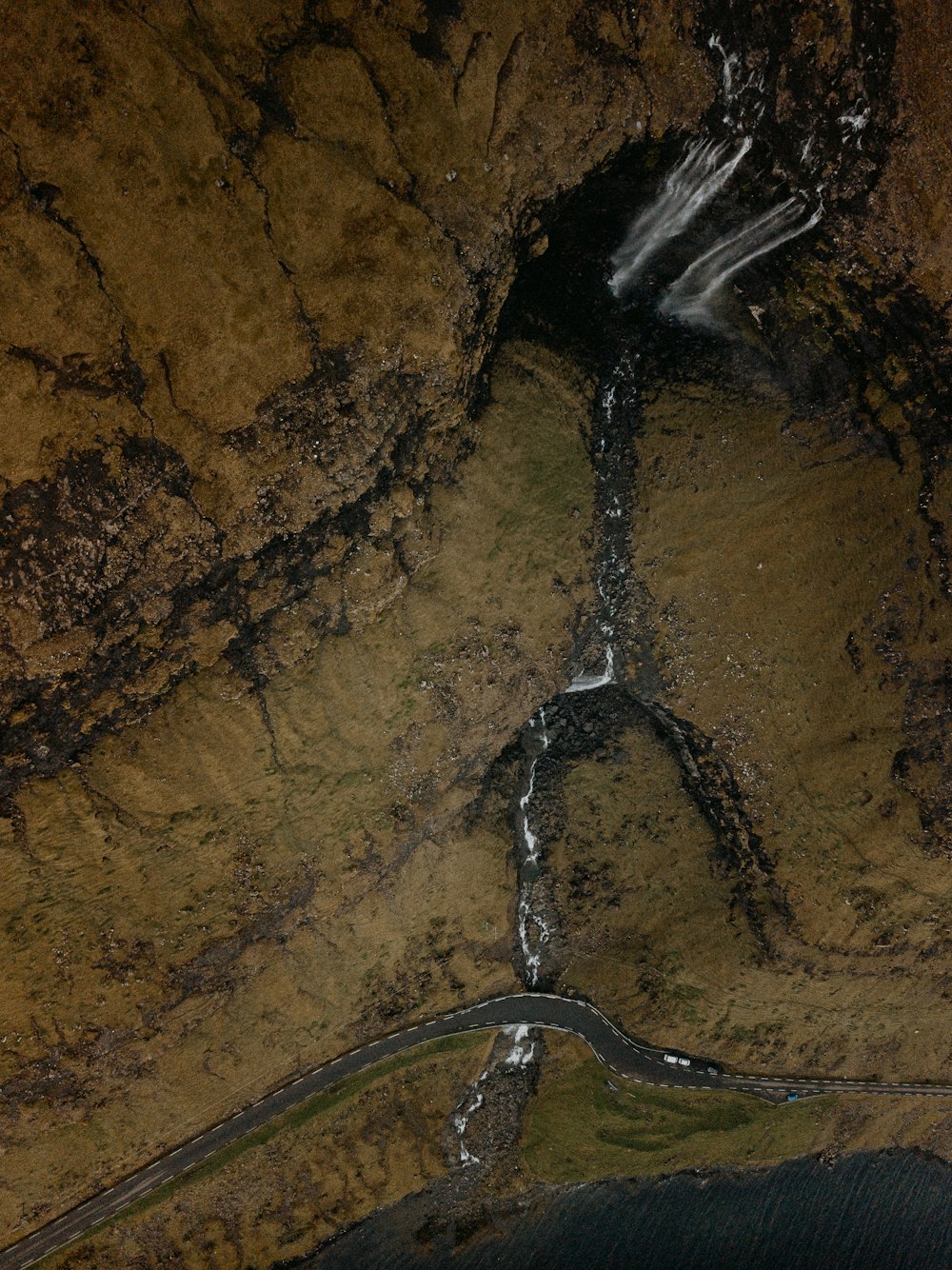 water flowing on brown soil