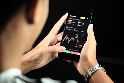 A sleek smartphone screen displaying real-time buy and sell signals with clear stop-loss and target markers.