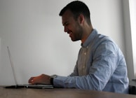 An image of a satisfied customer using a laptop with a strong internet connection, representing customer satisfaction.
