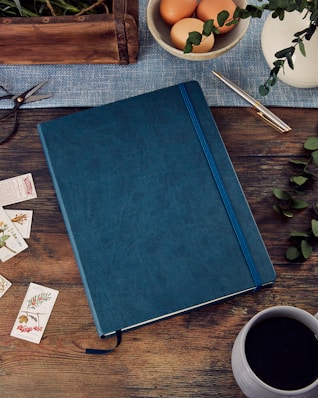 blue book on brown wooden table