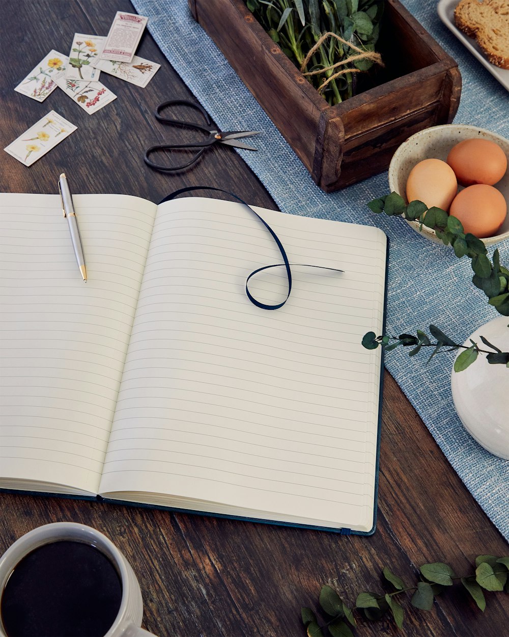 black framed eyeglasses on white notebook