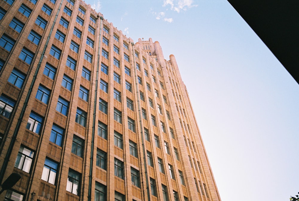 brown concrete building under blue sky during daytime