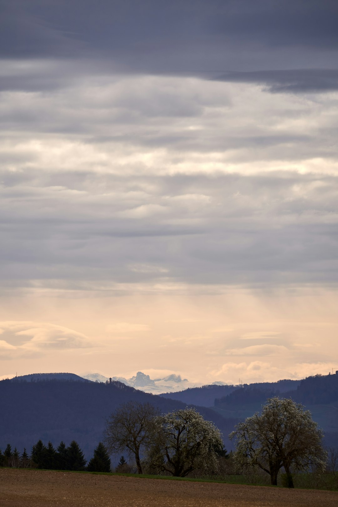 green mountains under white clouds during daytime