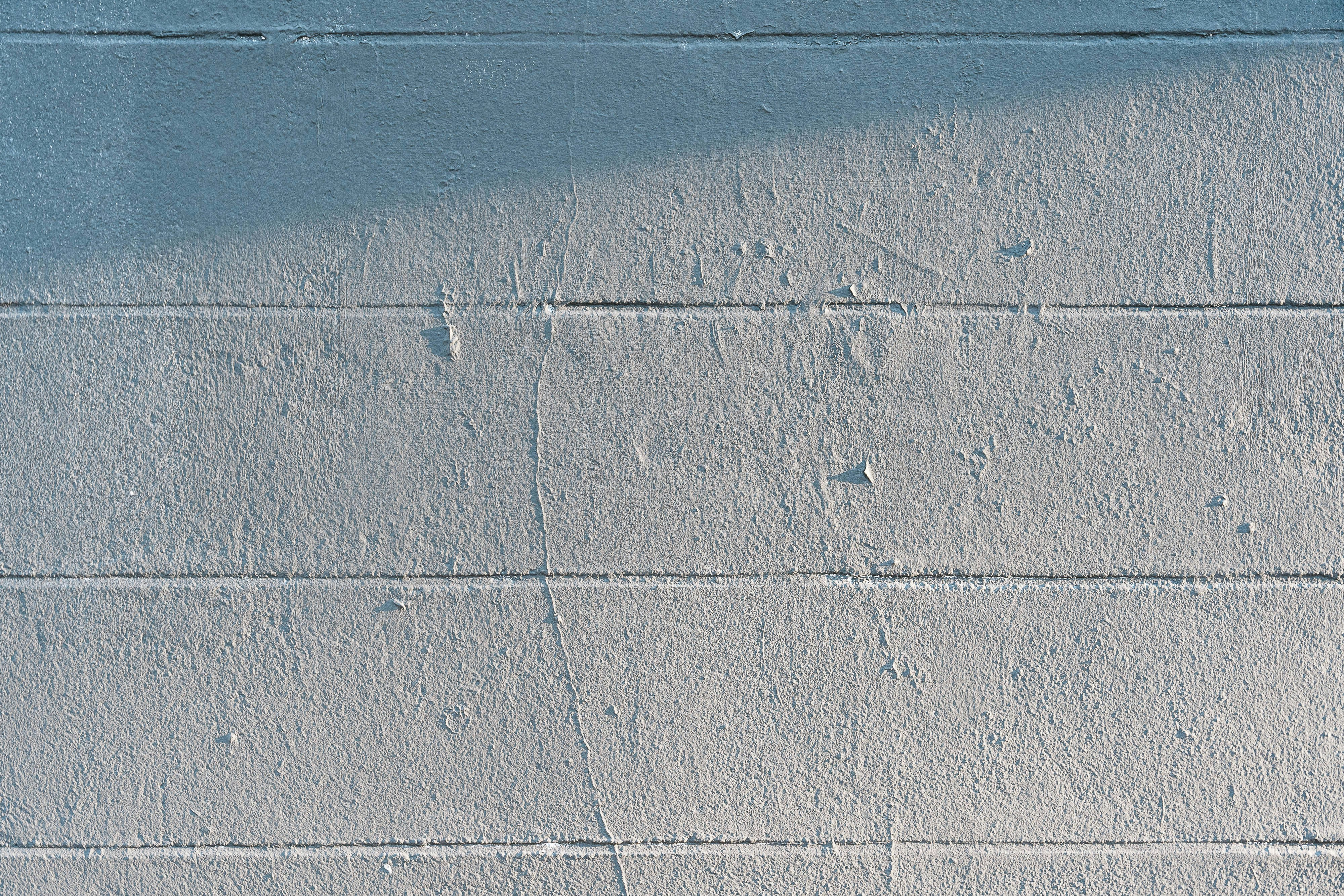 Basement wall illustrating vertical, horizontal, and stair-step cracks with labels - Cracked concrete foundation