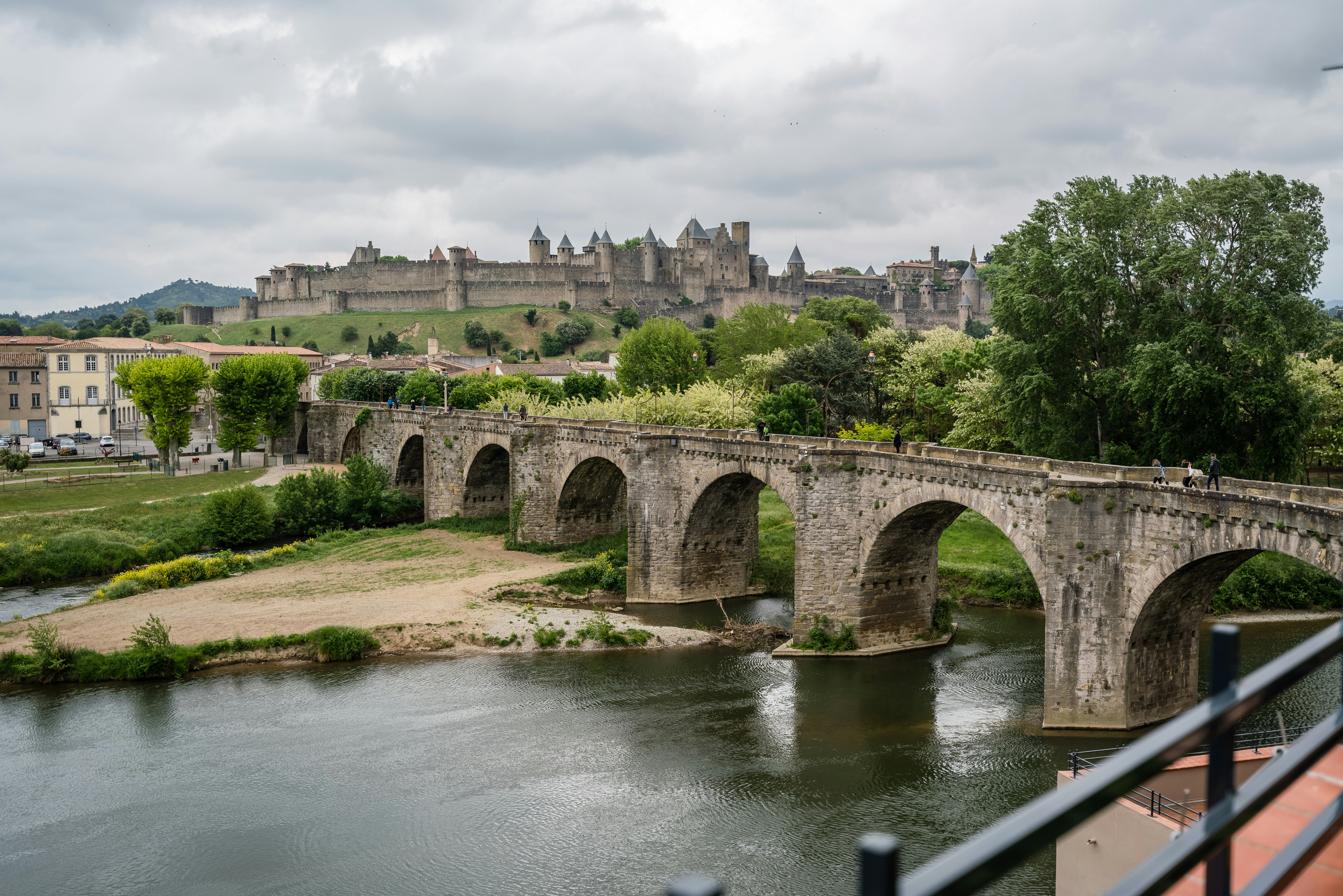 gray concrete bridge over river during daytime