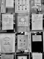 Close-up of hygiene safety signs in a commercial workplace.