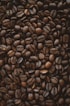 brown coffee beans on black surface