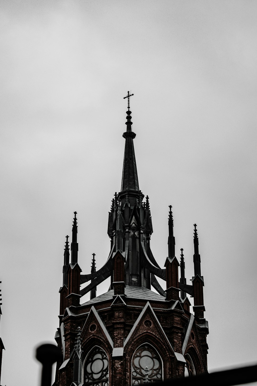 black and red concrete building under white sky