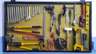 assorted hand tools on brown floor