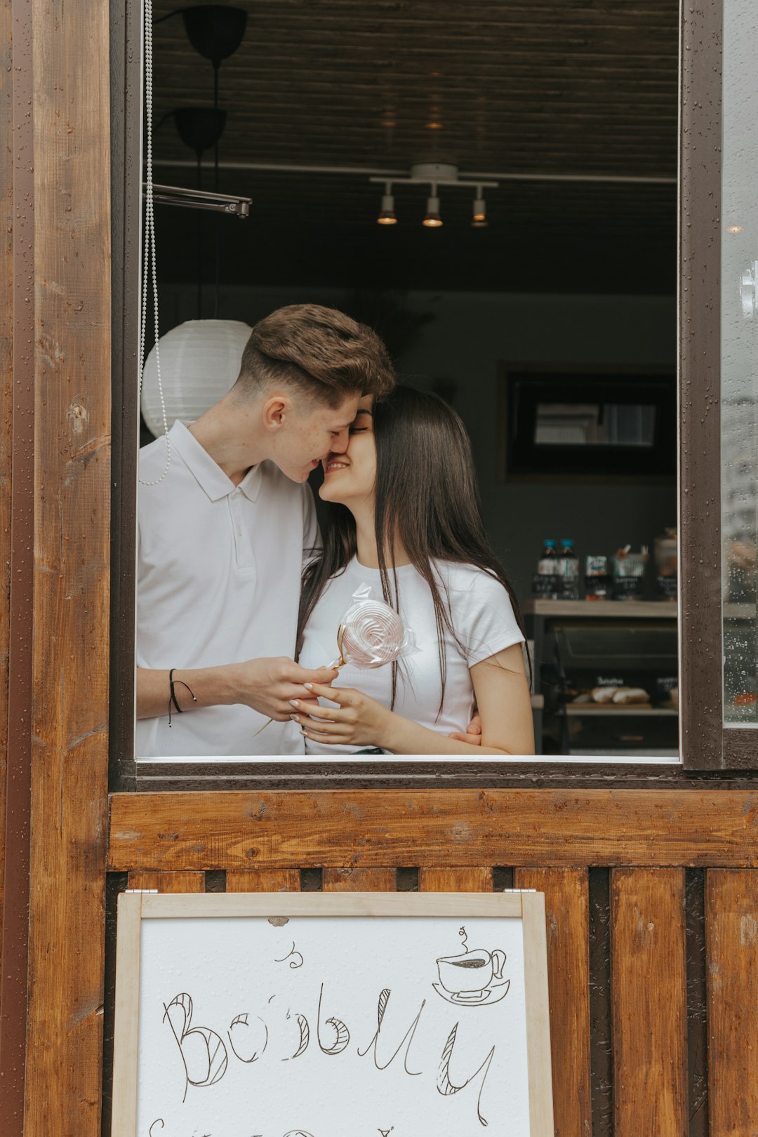 woman in white button up shirt standing beside man in blue button up shirt