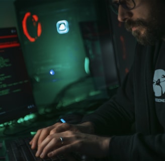 man in black jacket using computer