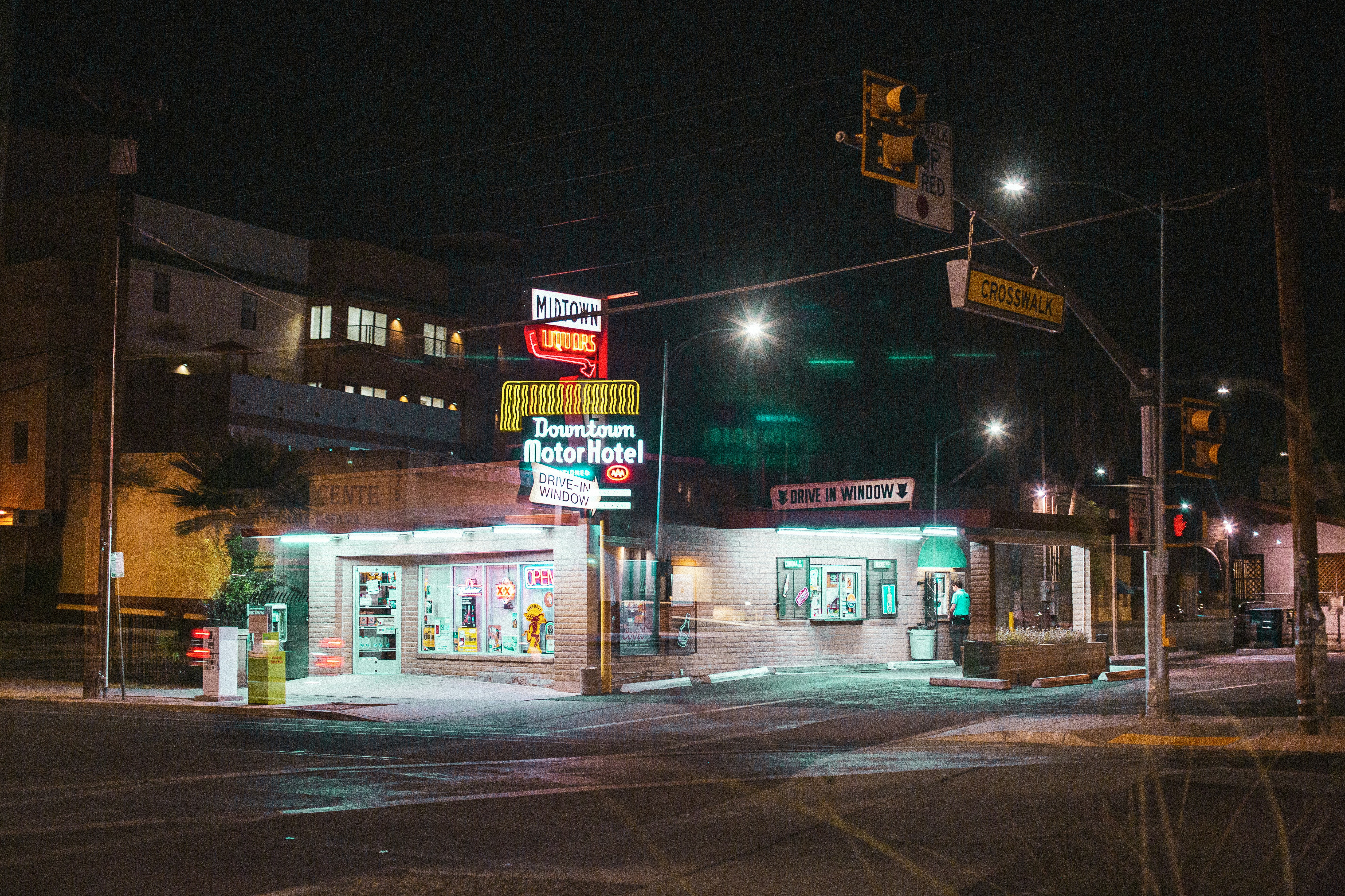 white and red store front during night time