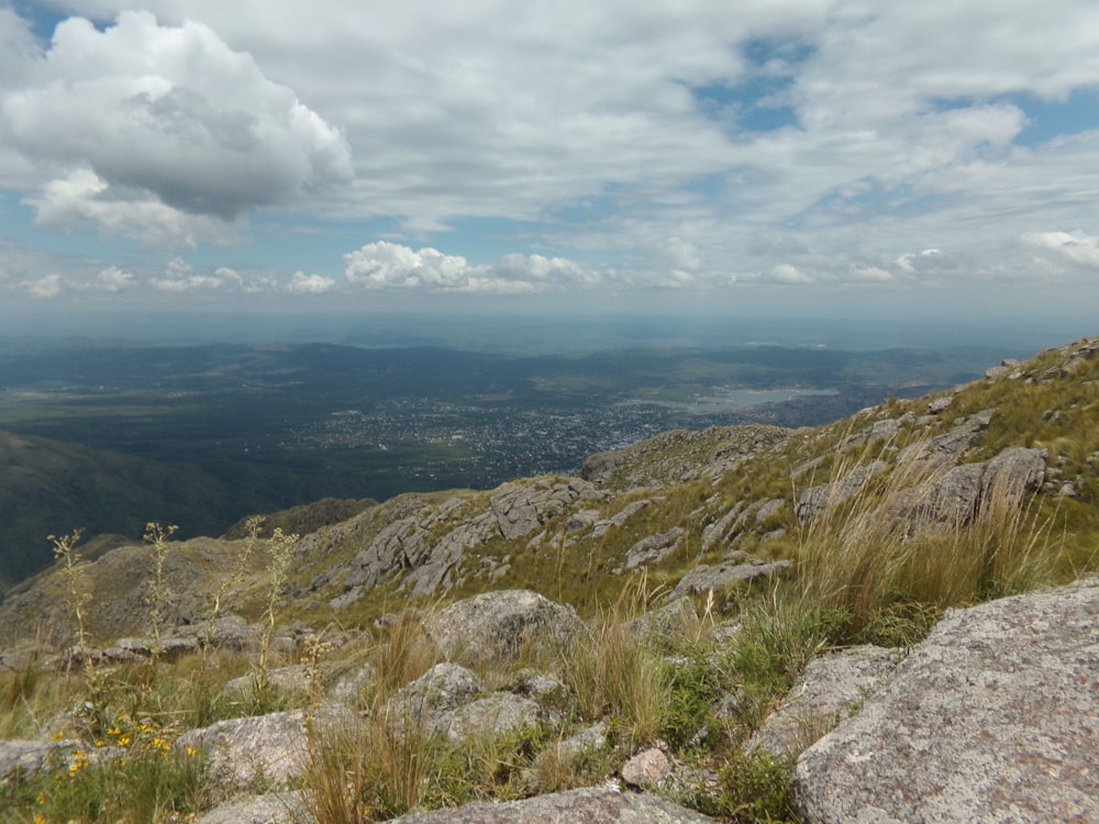 green and brown mountain under blue sky and white clouds during daytime