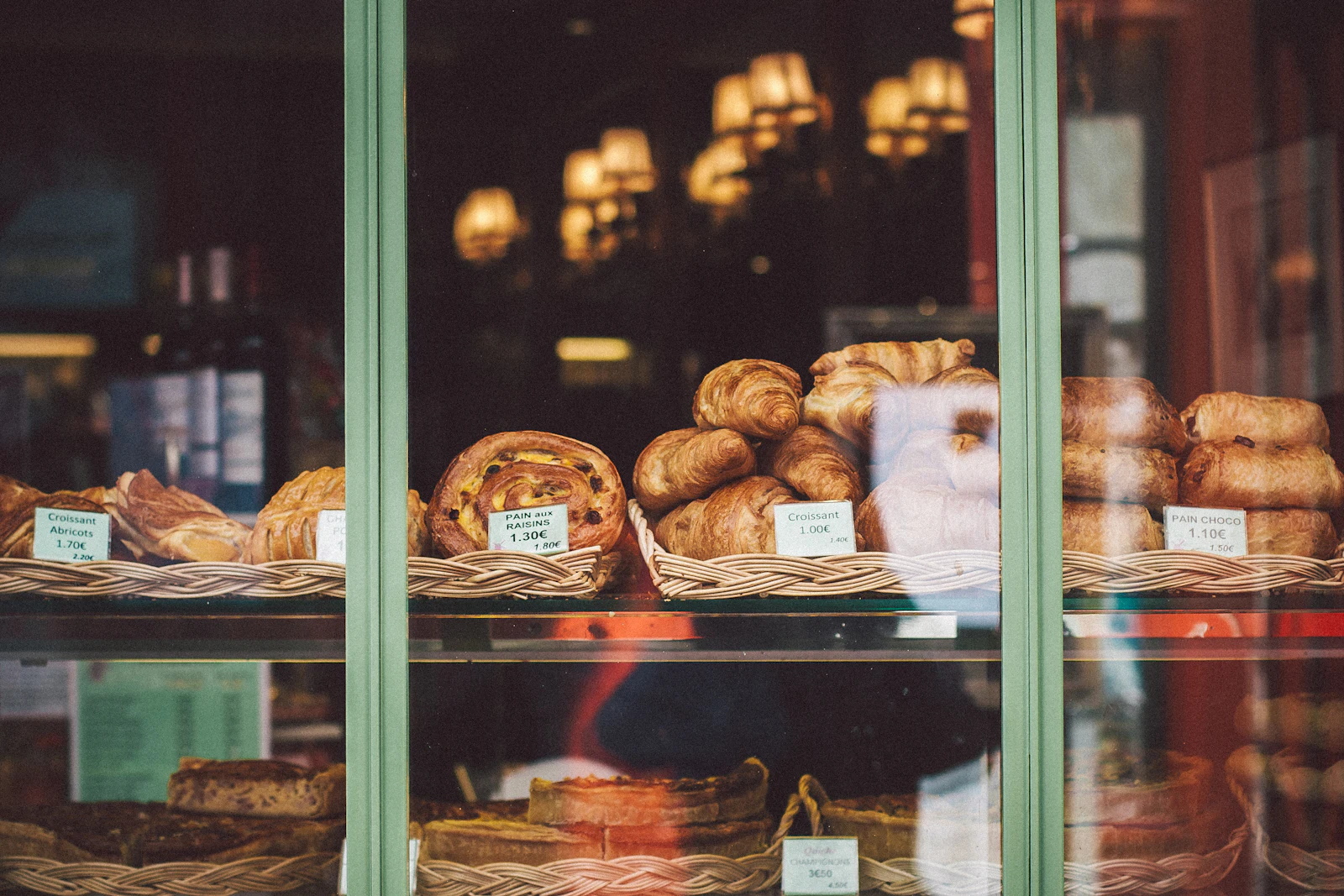 Bread and baked goods presented on a glass-fronted retail counter
