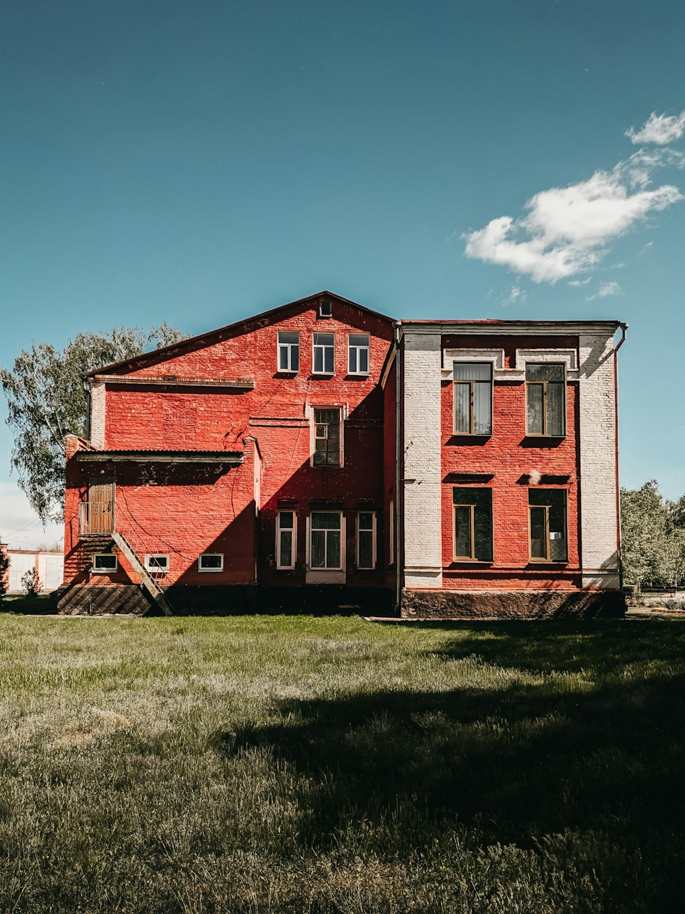 red and white concrete house under blue sky during daytime