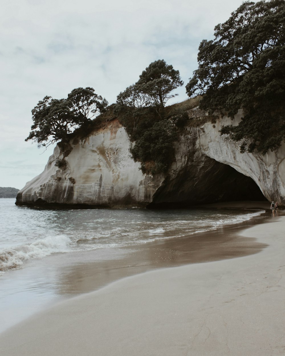 brown rock formation on sea shore during daytime