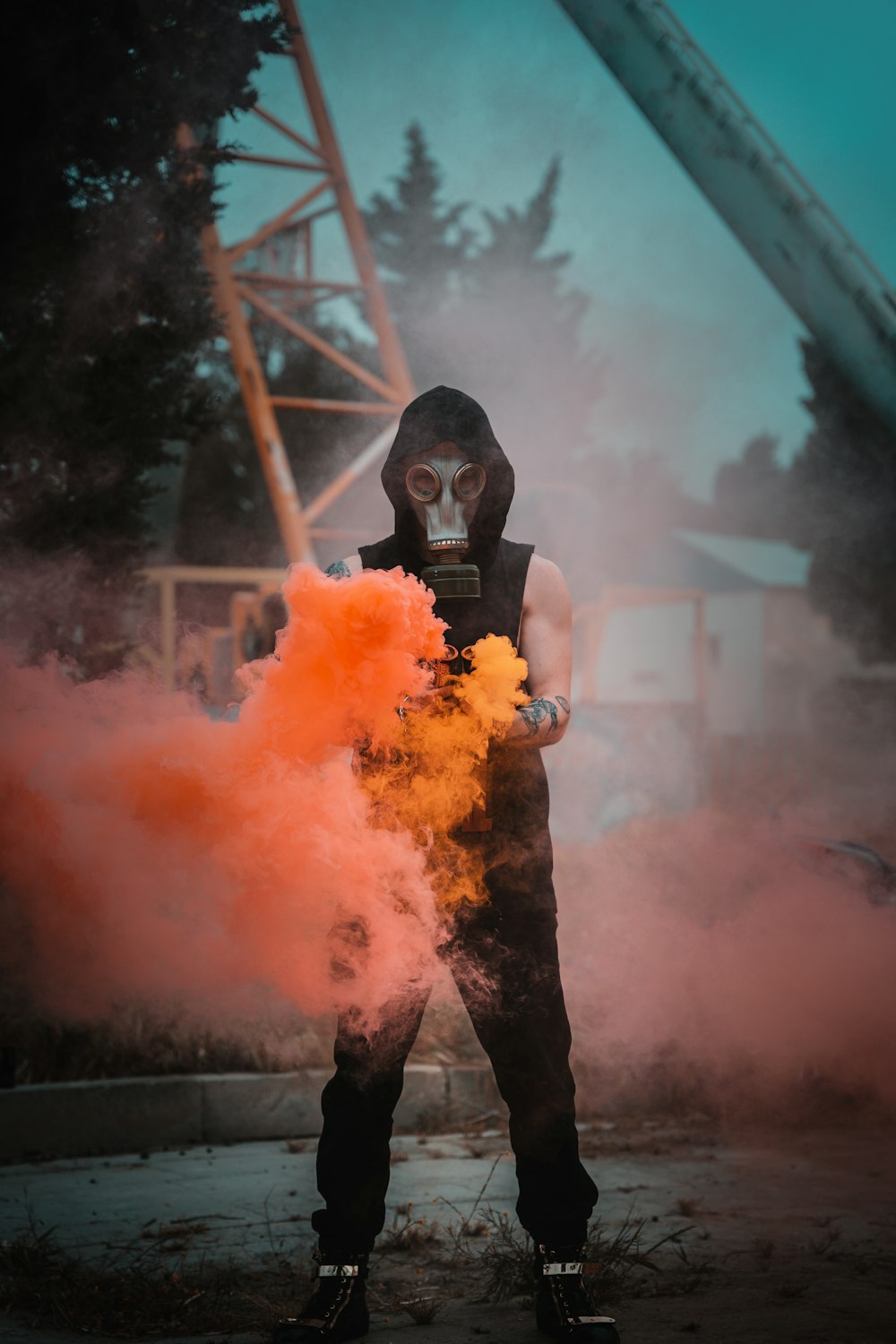 man in black shirt holding orange powder