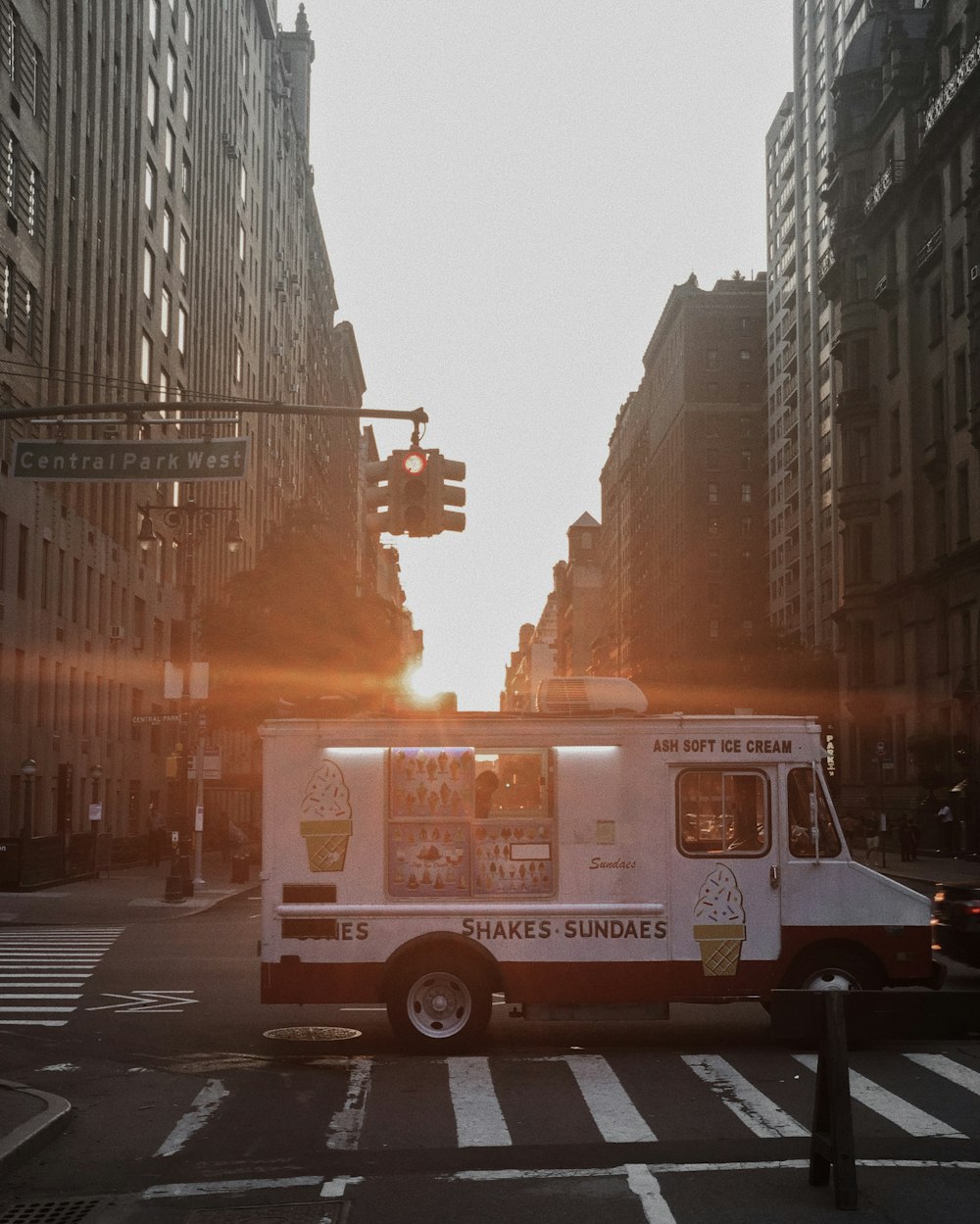 white and red bus on road during daytime