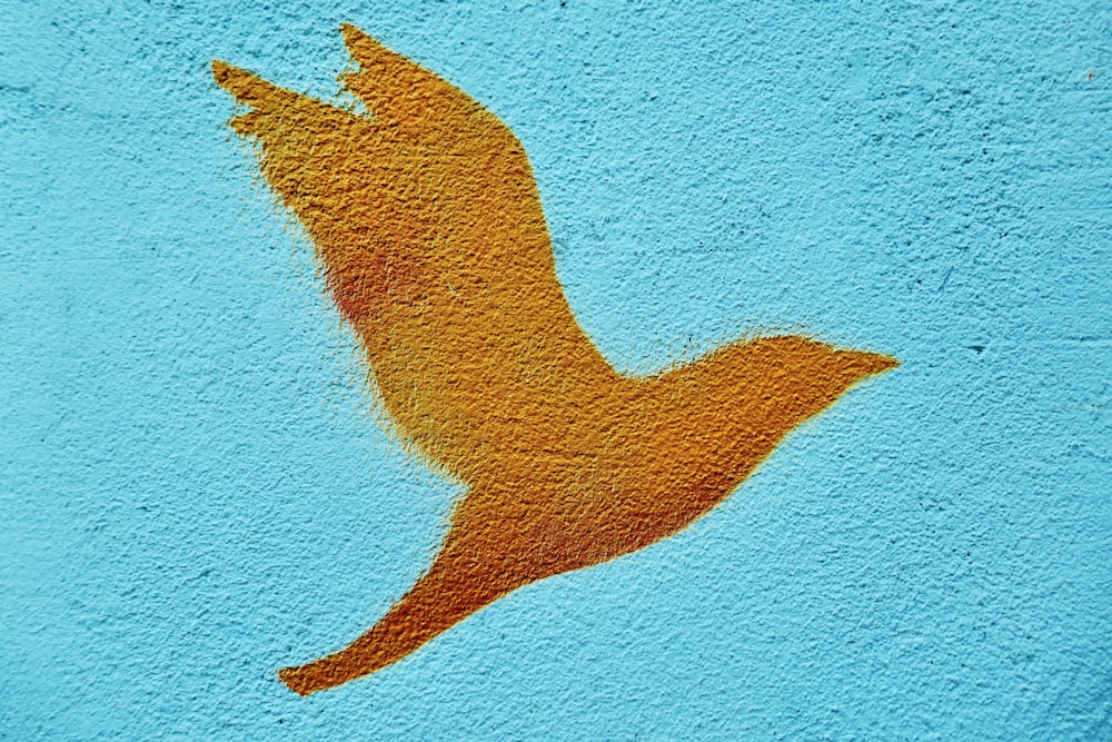 blue painted concrete wall with brown shadow