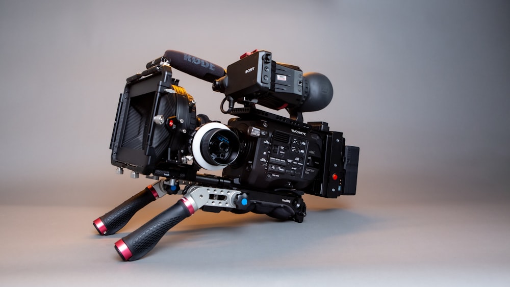 black dslr camera on white table