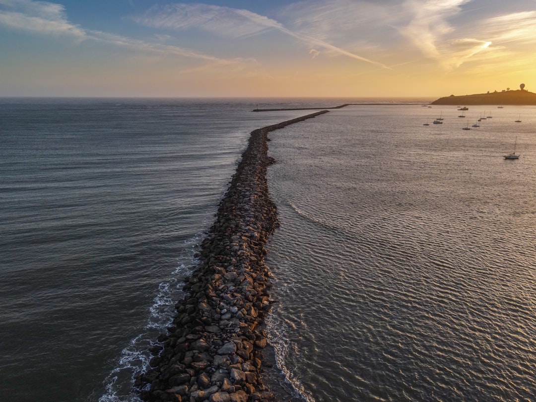 gray rocky shore during sunset